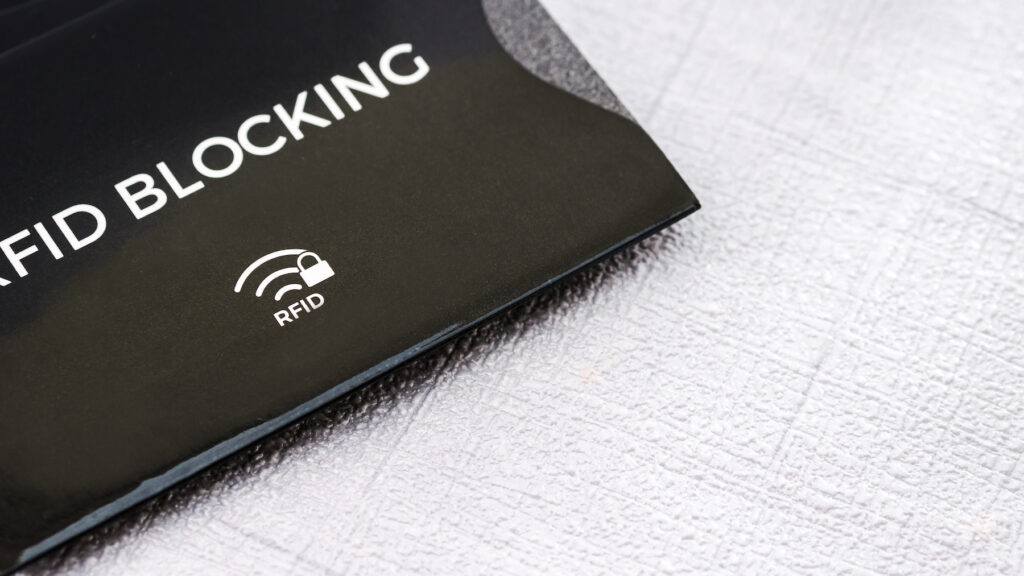 Black RFID blocking sleeve for secure credit card from fraud.
