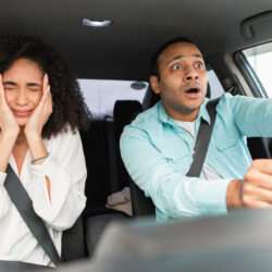 Traffic Danger. Stressed Middle Eastern Couple Having Risk Of Road Accident Driving Car, Woman Covering Face In Fear. Transportation Safety Problems, Vehicles Crash Concept