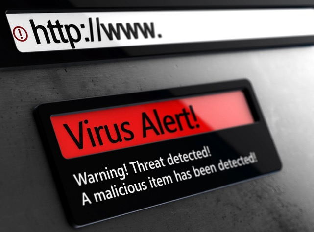 Computer screen with a Virus Alert message, warning a threat from a malicious item has been detected. 