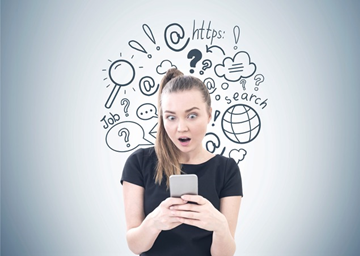 Woman looking at smartphone with graphics behind her.