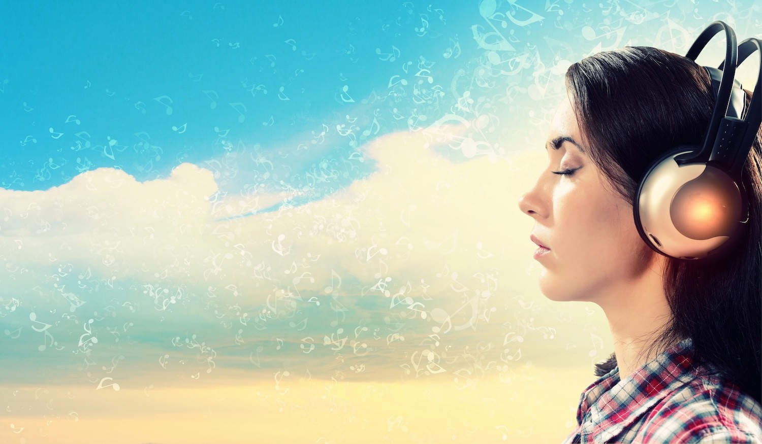 Young woman relaxing with eyes closed and headphones on. 