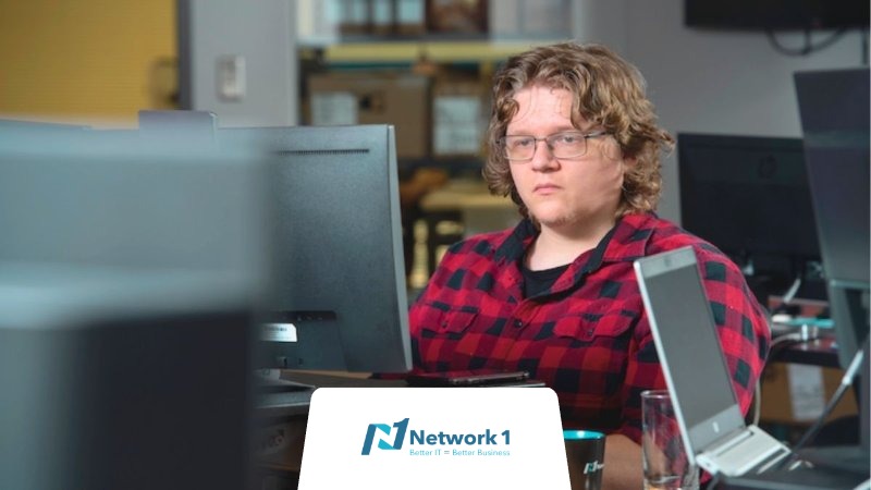 An employee at a computer working at one of the many big tech companies in Atlanta.