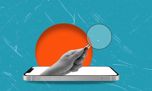 A hand with a magnifying glass sticking out of a smartphone screen.
