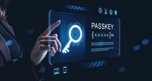 Woman interacting with futuristic passkey icon.