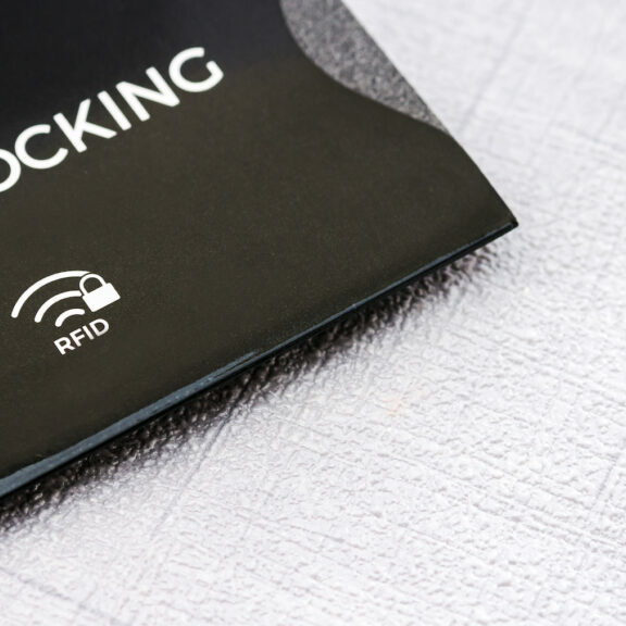 Black RFID blocking sleeve for secure credit card from fraud.