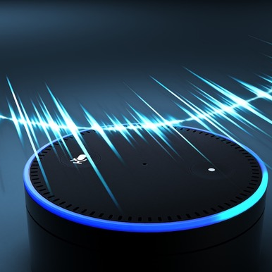 Amazon Alexa device with blue sound waves around it.