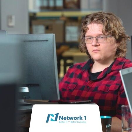 An employee at a computer working at one of the many big tech companies in Atlanta.